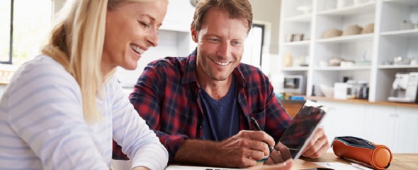 Couple researching health plans online