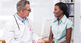 doctor speaking with woman