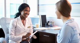 female doctor talking to woman