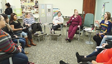 group of pregnant women sitting in a circle