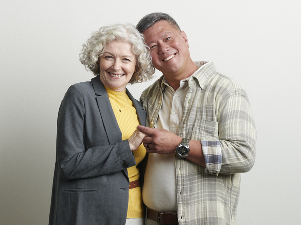 Happy mature couple holding hands