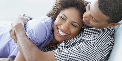 A smiling couple in an embrace