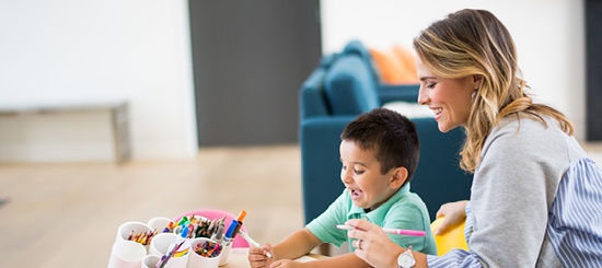 Mother and son coloring together