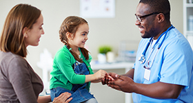 child getting care by doctor
