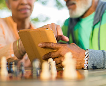 retired couple on ipad