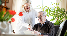 Older couple using an iPad