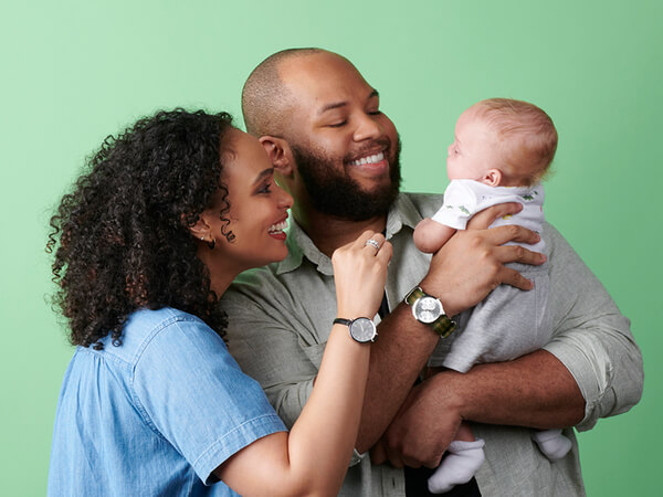 Happy parent holding their baby