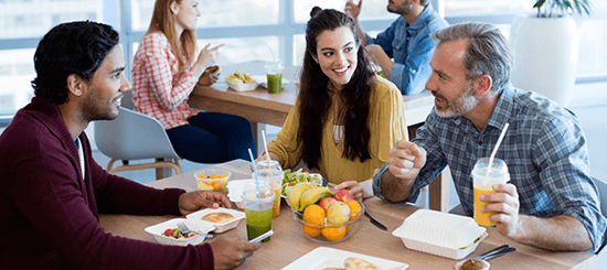 group of people eating a healthy lunch- 550x245