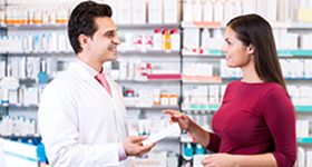 pharmacist giving scripts to patient