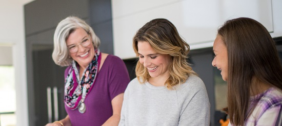 Mom and daughters in kitchen