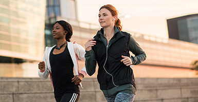 two-women-running-in-city