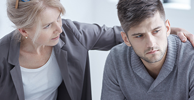 woman-comforting-adult-son
