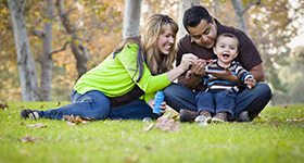 young family in the grass