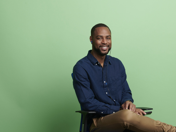 Man wearing business casual sitting in an office chair