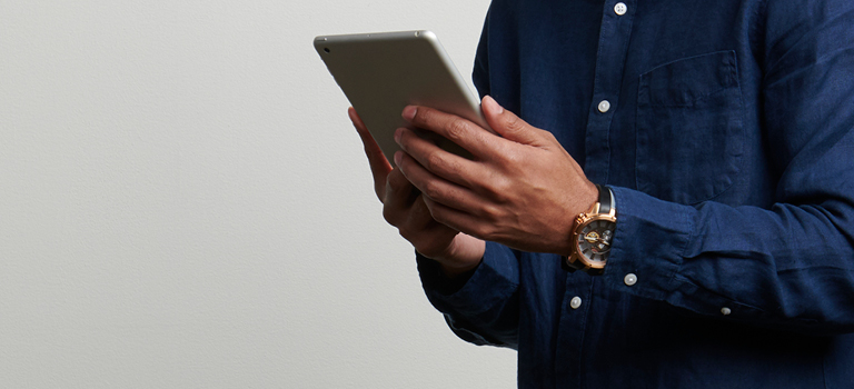 man holding ipad