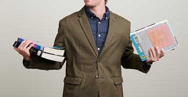 guy holding books