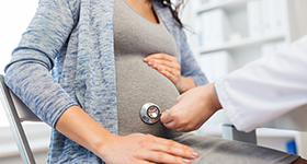pregnant woman with stethoscope