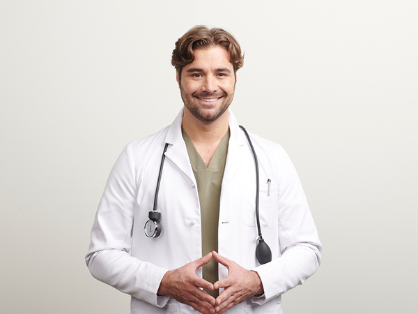 smiling man in lab coat