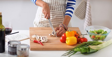 woman cutting vegetables