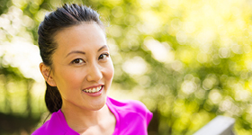 woman outside in a purple shirt