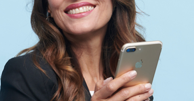 woman on tablet outdoors