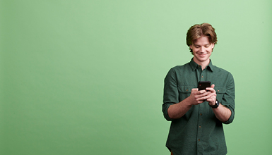 young man looking at phone