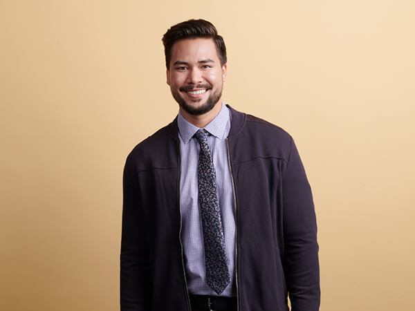 Smiling young man wearing business attire