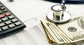Calculator, stethoscope, money
