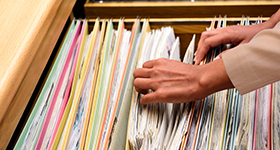 person going through files
