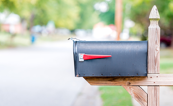 image of a mailbox next to a road