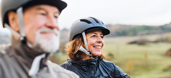 elderly couple biking