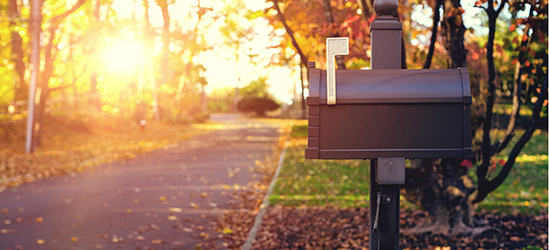 Red mailbox with letters