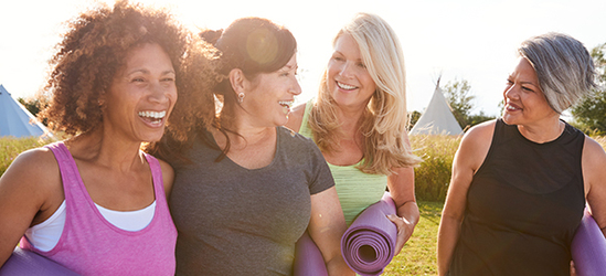 group with yoga mats