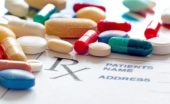 image of scattered prescription pills on an rx form