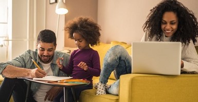 Family sitting in living room