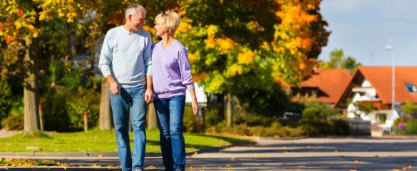 man and woman walking down street