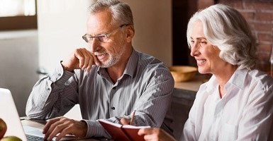 Senior couple on computer