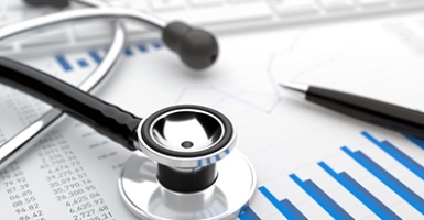 Stethoscope and pen on charts