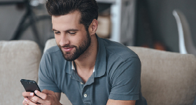 happy man looking at phone