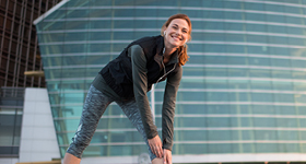 woman stretching in city