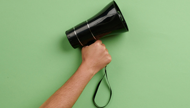 hand holding megaphone 